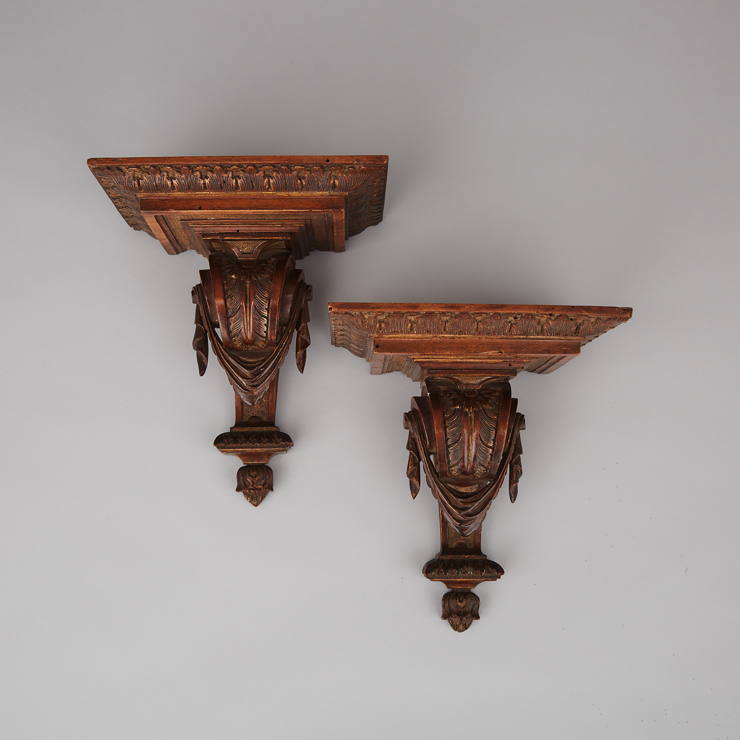 Pair of Neoclassical Parcel Gilt Carved Walnut Wall Brackets, 19th century